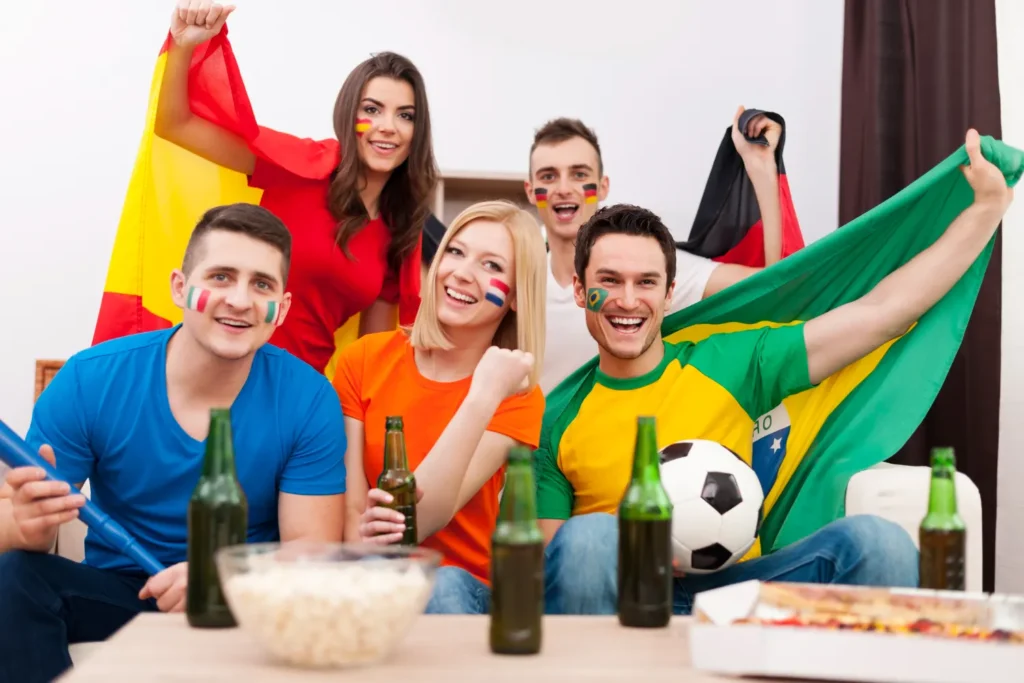 Aficionados internacionales viendo el Mundial de fútbol con los mejores precios IPTV en España
